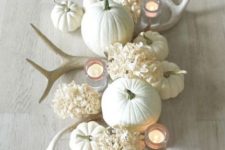 21 antlers, white pumpkins, and white hydrangeas for a refined centerpiece