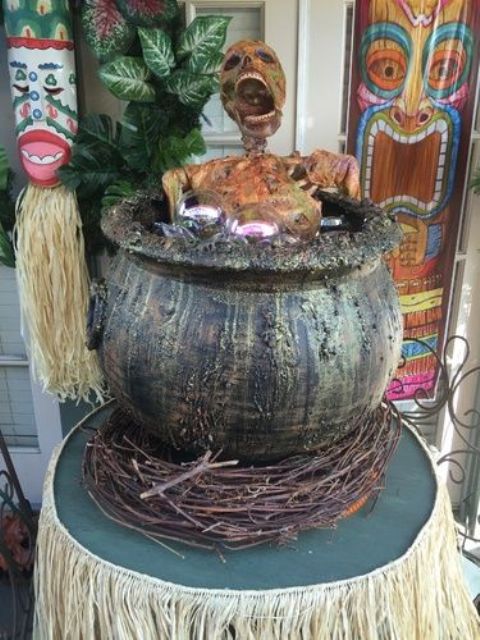 tiki party done right - a skeleton cooked in a cauldron