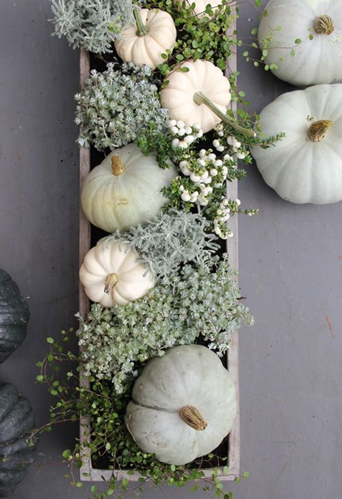 box centerpiece with white pumpkins, greenery and flowers