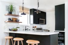 24 small black and white space with warm woods added for coziness