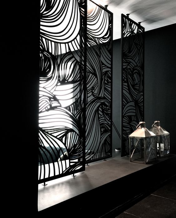 stunning metal laser cut screens divide the spaces and add chic to the interiors
