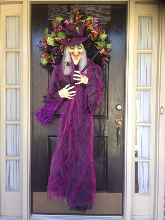 door wreath with a whole witch doll in purple