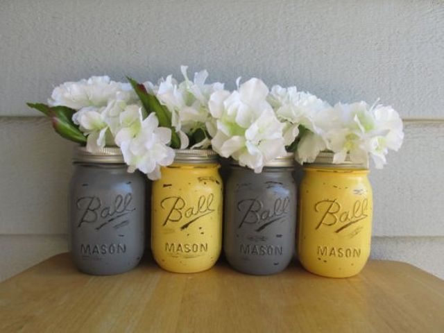 grey and yellow distressed mason jars as vases can be an easy DIY project