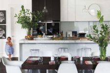 29 greenery in vases enlivens this monochrome space