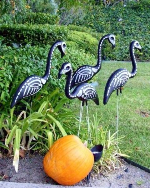 black skeleton flamingos and a pumpkin will make your Halloween bold