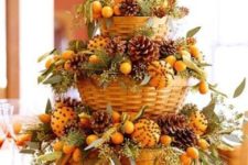 36 tiered centerpiece of baskets with pomanders, pinecones and fir branches