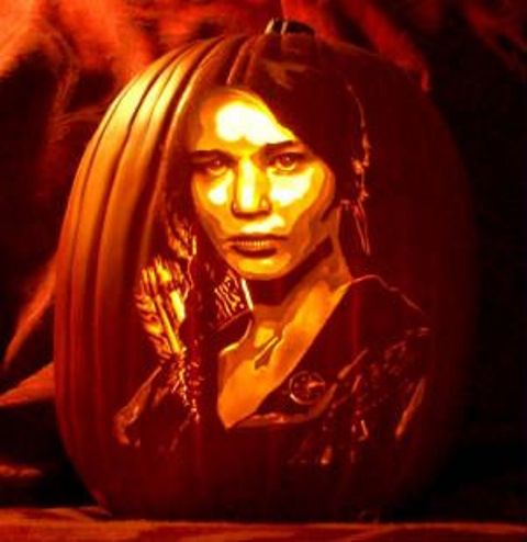 Katniss Everdeen from The Hunger Games carved on a foam pumpkin