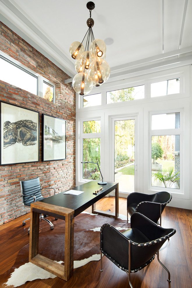 a brick wall doesn't look rough when a home office features lots of windows that help to fill it with natural look (Paramax Homes)