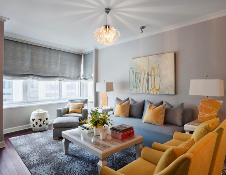 A grey sofa goes well with yellow arm chairs and yellow pillows. (Bankston May Associates)