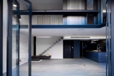 01 This large two-storey apartment was renovated and turned into a chic modern space with minimalist decor