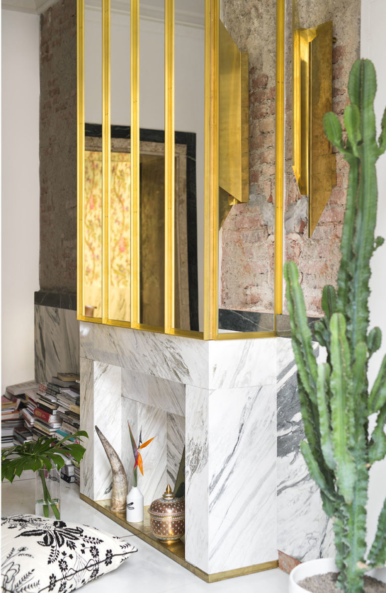 Carrara marble is one of the luxurious materials used throughout the house, and it works well with a gilded framed mirror Carrara marble is one of the luxurious materials used throughout the house, and it works well with a gilded framed mirror