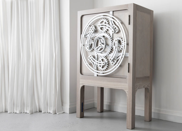 It looks like a usual light colored cabinet but the mechanism on the door is stunning and it really functions It looks like a usual light-colored cabinet but the mechanism on the door is stunning and it really functions