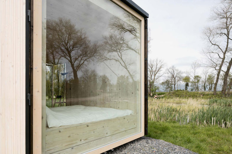 bedroom with windows The Ark shelter has a large window, which allows enjoying the views right in a bedroom and brings much light in