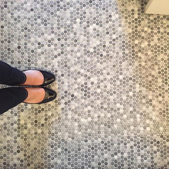 gray speckled penny tile floor is a cool neutral idea that fits many styles