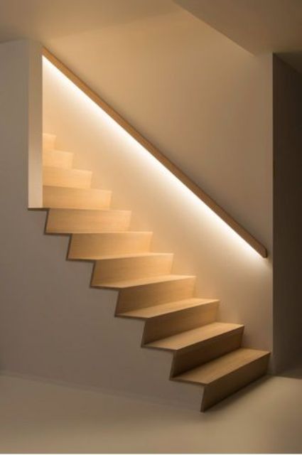 hidden lights in the banister lights up the staircase so the owners don't need any lights while walking up or down