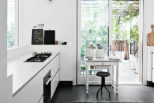 03 The floor in the kitchen is covered with dark tile to make it more practical and create a contrast