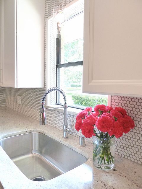 add a little texture to your backsplash with white penny tiles and grey grout