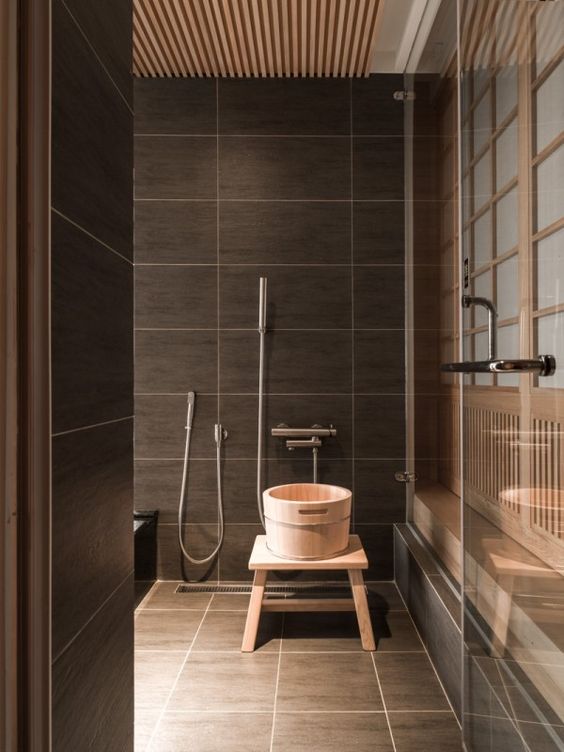 earthy brown bathroom tiles look awesome with light woods and bring a luxurious feel to the space