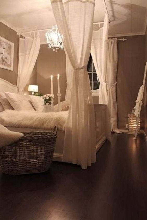shabby chic bedroom with a crystal chandelier and candles for a soft glowing look