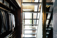 04 The closet is hidden downstairs, it’s elegant, light-filled and with bold brass accents