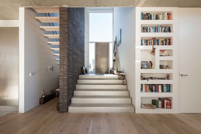 creative storage The interiors are modern and minimalist, with creative built-in storage and sculptural decorations
