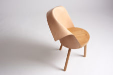 05 Clop has wooden legs and a seat and a leather backrest folded in a comfortable way