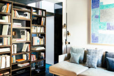 05 The living room is lighter and fresher, black marble on the floor, beige textiles and blue accents look chic and welcoming