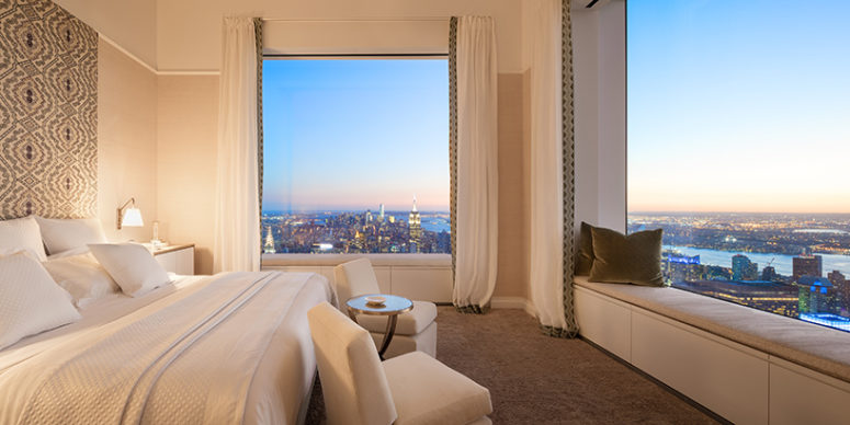 bedroom with views The master bedroom features large windows and is done in the same color palette, with the same cool textiles for a soft and chic look