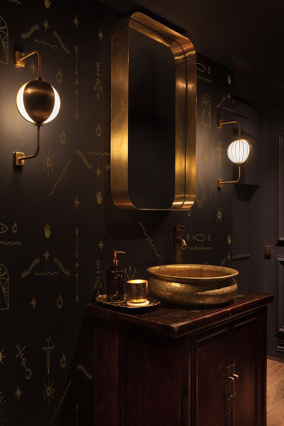 dark wood cabinet, black patterned walls and brass decorations