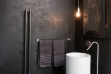 06 industrial bathroom with a white free-standing sink that pops up