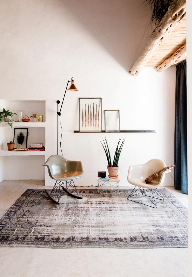 eclectic house A small sitting space by the entryway has some mid-century modern furniture that looks harmonious