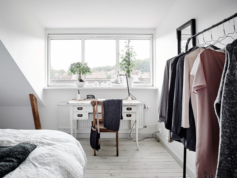 There's a small home office nook by the window, and I love the tiny white desk in shabby chic style