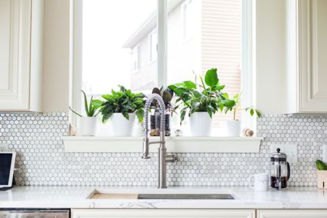 spruce up a white or ivory kitchen with a mother-of-pearl backsplash that is shining a bit