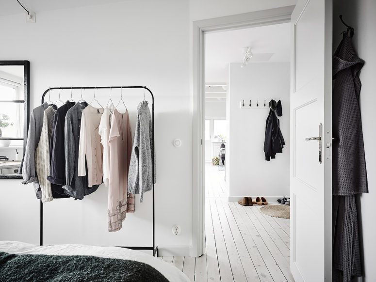 The clothes hanger is great for storage and besides such open closets are in trend now