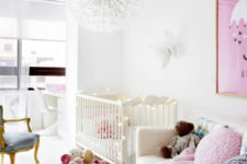 09 The kid’s room is done in white and pink, with a cute lamp and a couple of refined touches