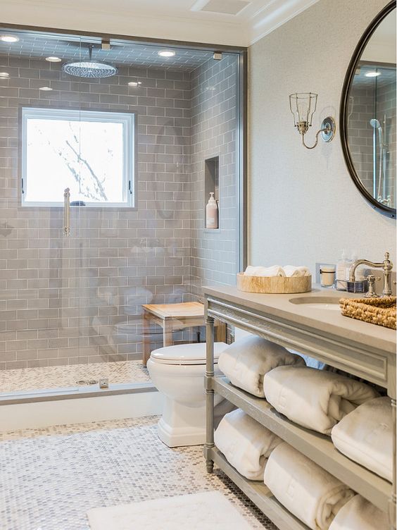 modern bathroom with grey subway tiles highlighting the shower