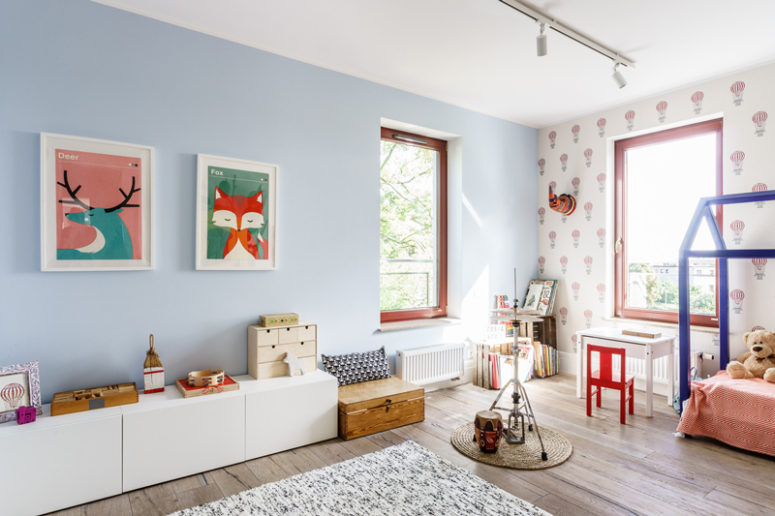 The kid's room is done in pastels and highlighted with bold touches