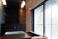 10 sensual bathing area with black tiles and light wood slabs that keep the space minimalist yet very luxurious