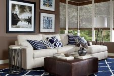 11 modern brown and white living room with navy pillows and a carpet