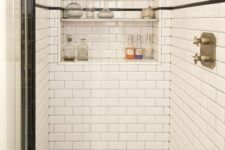 white subway tiles and black and white hex tiles on the floor create a lovely vintage-inspired shower space look, add niche shelves