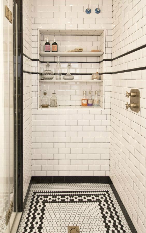 white subway tiles in the shower and hexagon black and white ones on the floor