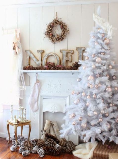 white tree with soft pastel ornaments and natural pinecones for balanced decor