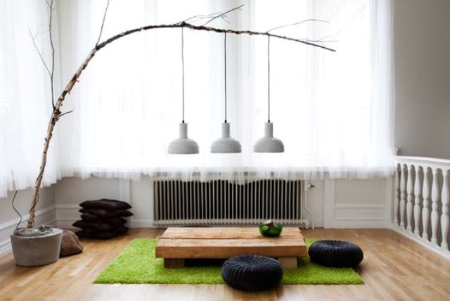 tea ceremony zone with a low rough wood table and floor cushions