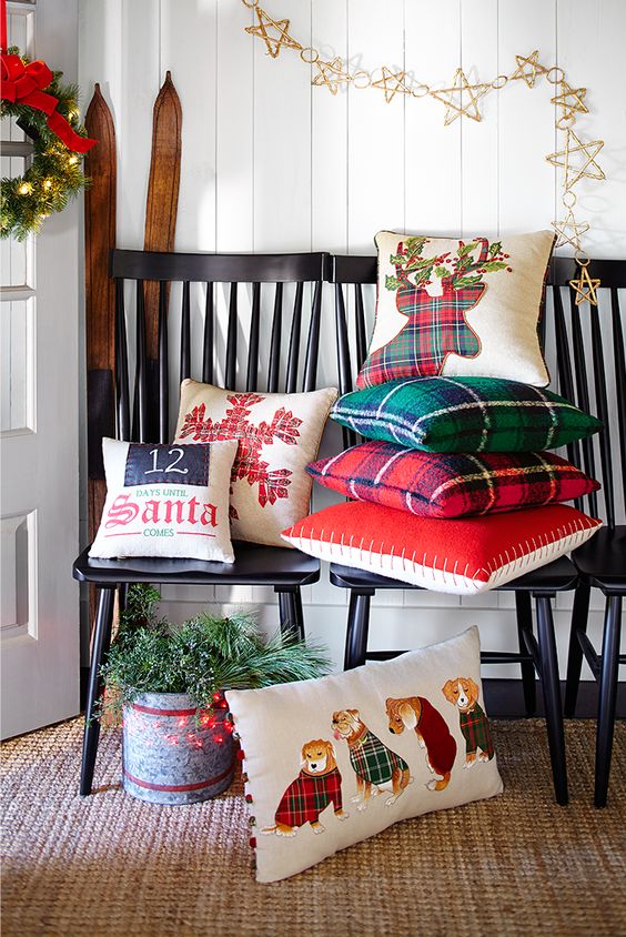 throw some Christmas-themed pillows and a holiday wreath to turn your entryway into a winter one