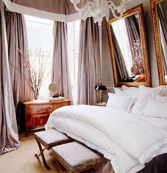 luxurious bedroom with pink curtains and white bedding