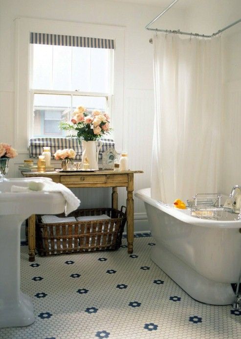 rustic vintage bathroom with flower penny tile floor