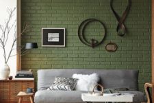 14 sage green brick wall and a grey sofa