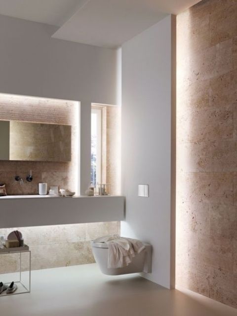 this bathroom features only hidden lights for minimalist style