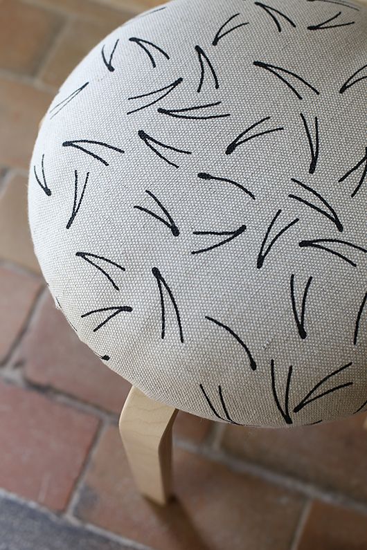 upholster the seat with some cheap fabric, decorate it with a sharpie if you want