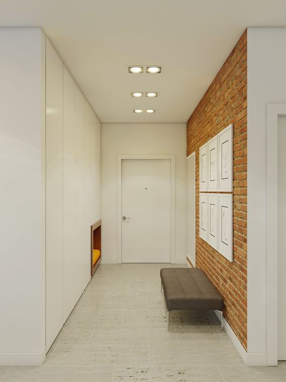 minimalist entryway with a red brick wall made with panels